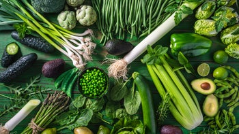 Health: Diet and nutrition: flat lay various green vegetables on green table-1318478175