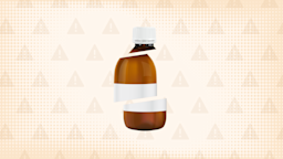 In the center of a light tan background with texture and warning sign pattern is a brown medicine bottle cut into thirds. 
GoodRx Health