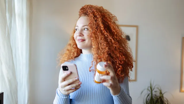 Pharmacy: woman refilling prescription 2008779857