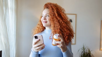 Pharmacy: woman refilling prescription 2008779857