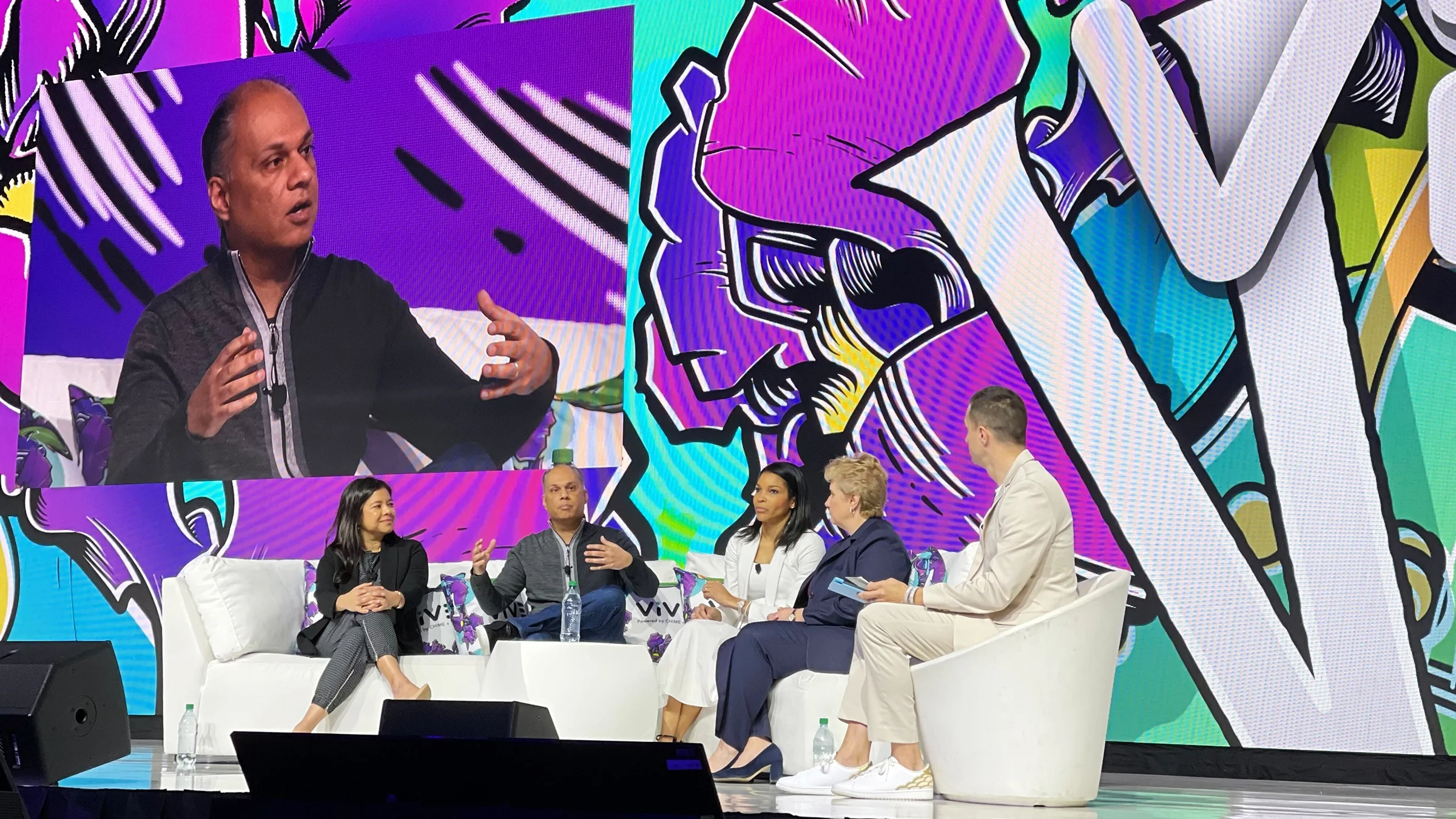 Raj Beri speaks with a panel on stage at the ViVE Conference.