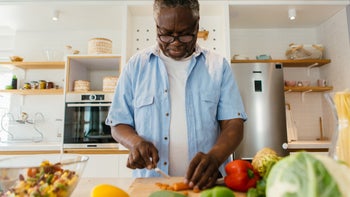 Health: Covid-19: man cutting carrots 1342045739