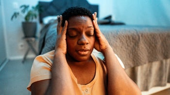 Mental-health: emotional woman sitting on bedroom floor 1678861983