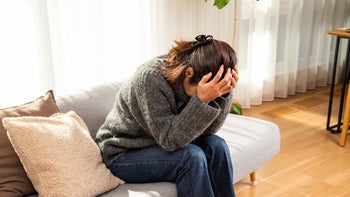 migraine: woman with a migraine 1784055667