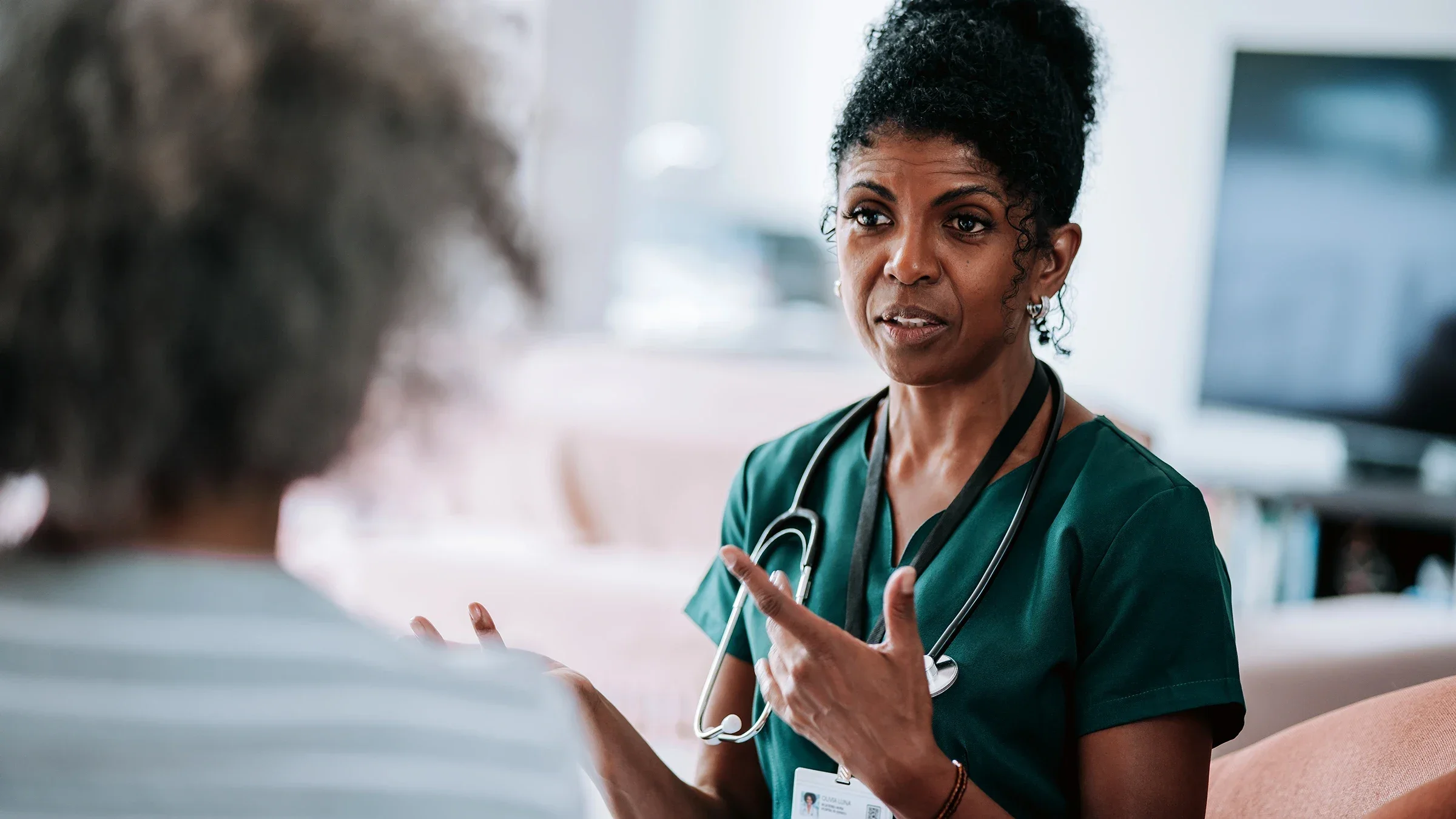 HCP speaking to a patient
andreswd/E+ via Getty Images