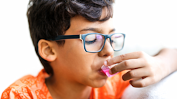 A child takes liquid medication.
Pollyana Ventura/iStock via Getty Images Plus