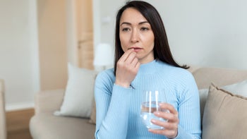 Zantac 360: 	putting pill in mouth 1391580544