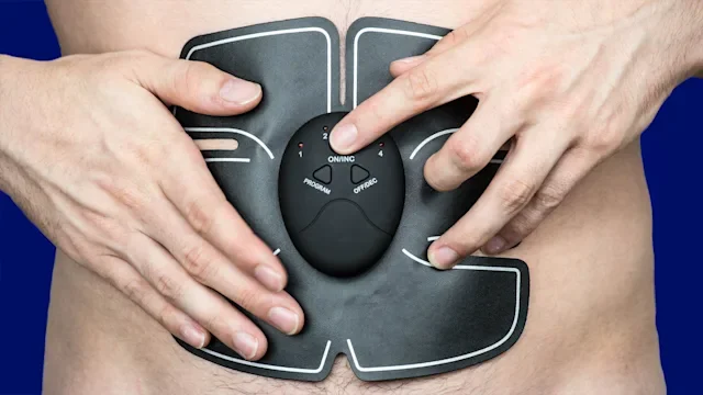 Movement-exercise: closeup ab stimulator 1021707260