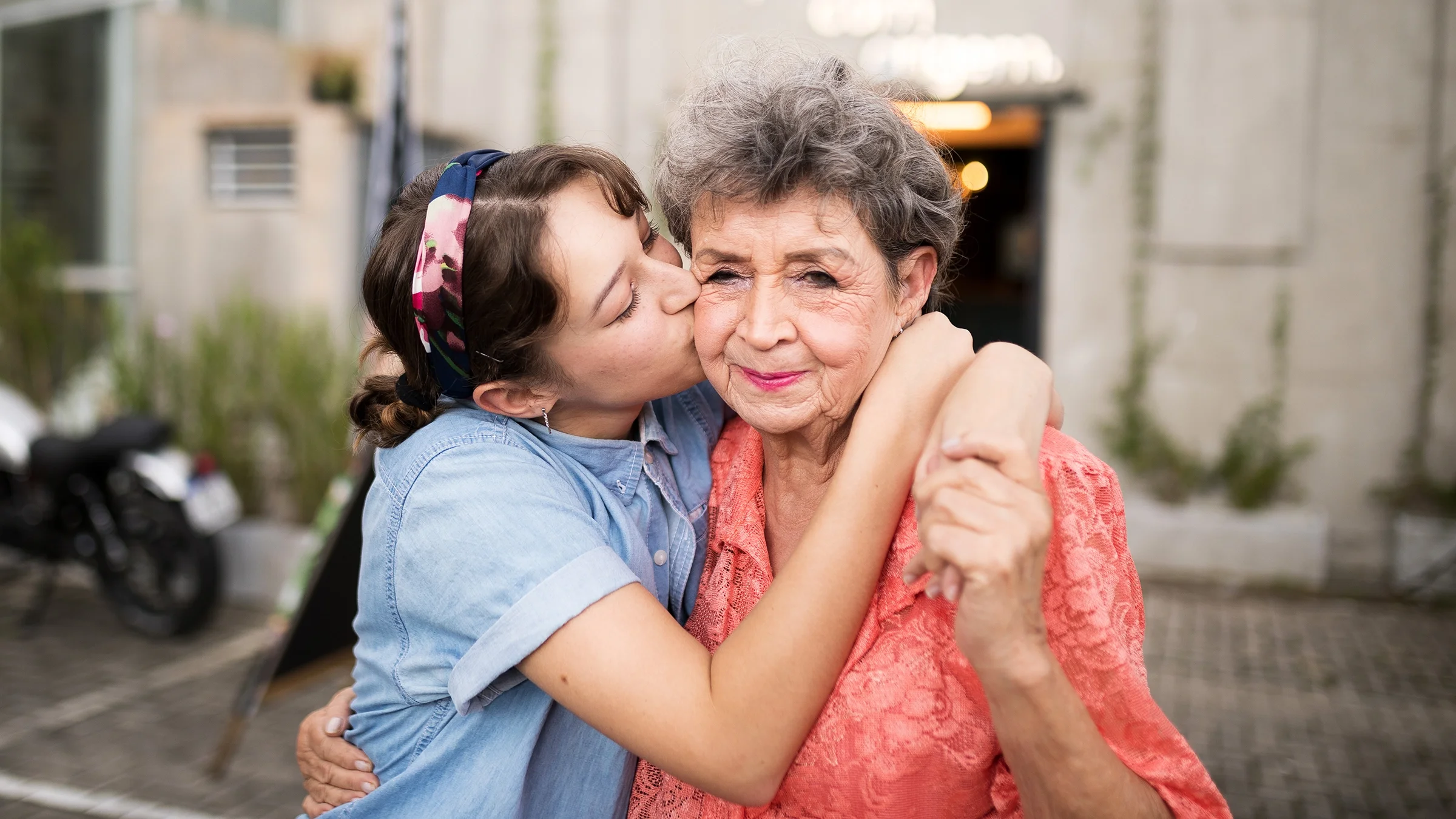 A grandmother and granddaughter spend time together. People with dementia can experience problems from the condition, such as pneumonia and heart disease, that can lead to death.