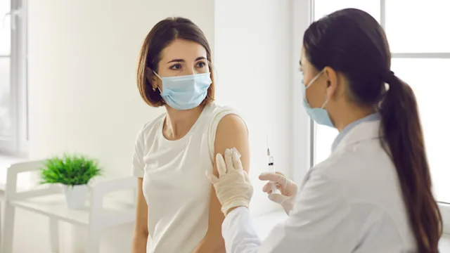 Vaccine: Johnson and Johnson: hcp talking to patient before vaccination 1304852809
