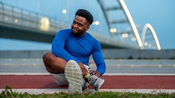 Movement Exercise: man holding his leg 2060299634
