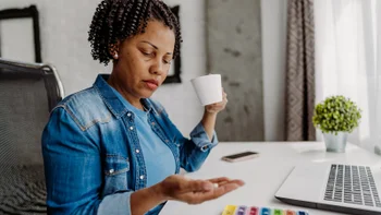 Foundayo: woman taking medication 2239967684