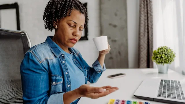 Foundayo: woman taking medication 2239967684