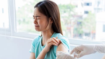 Health: Phobias: nervous woman receiving injection 1313941030