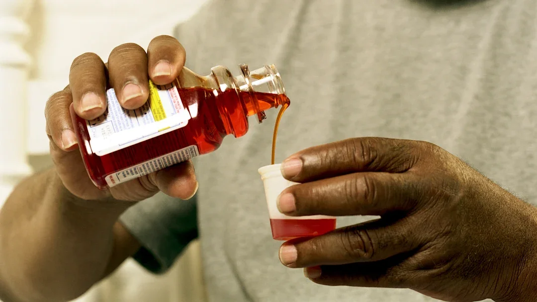 Bronchitis: Respiratory: closeup man pouring cough medicine 200214551-001