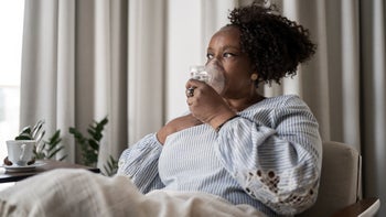Pneumonia: woman using nebulizer 1309471810