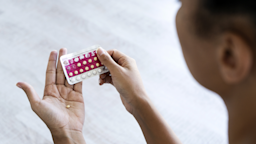 A women removes a birth control pill from the blister pack.
Mindful Media/iStock via Getty Images Plus