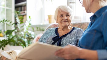 Health: Dementia: senior woman photo album 1248708507