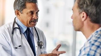 hepatitis-c: doctor speaking to a patient 593309604