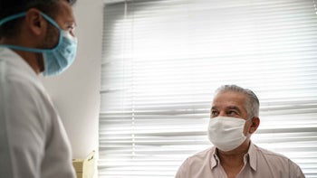 COVID-19: doctor patient masked 1278289491