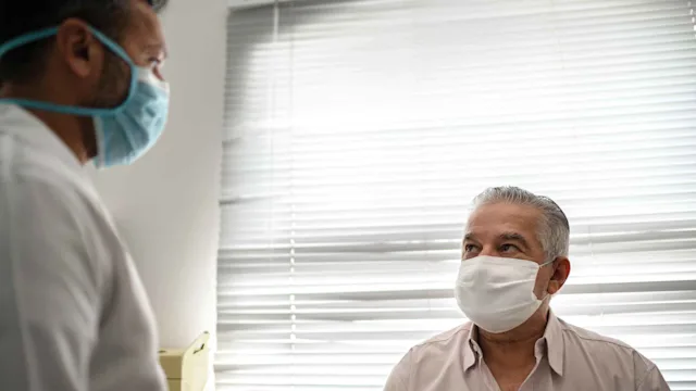 COVID-19: doctor patient masked 1278289491