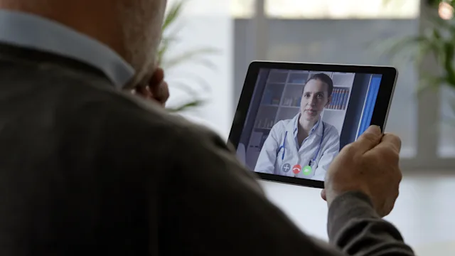 High cholesterol: senior man telehealth consultation 1319200189