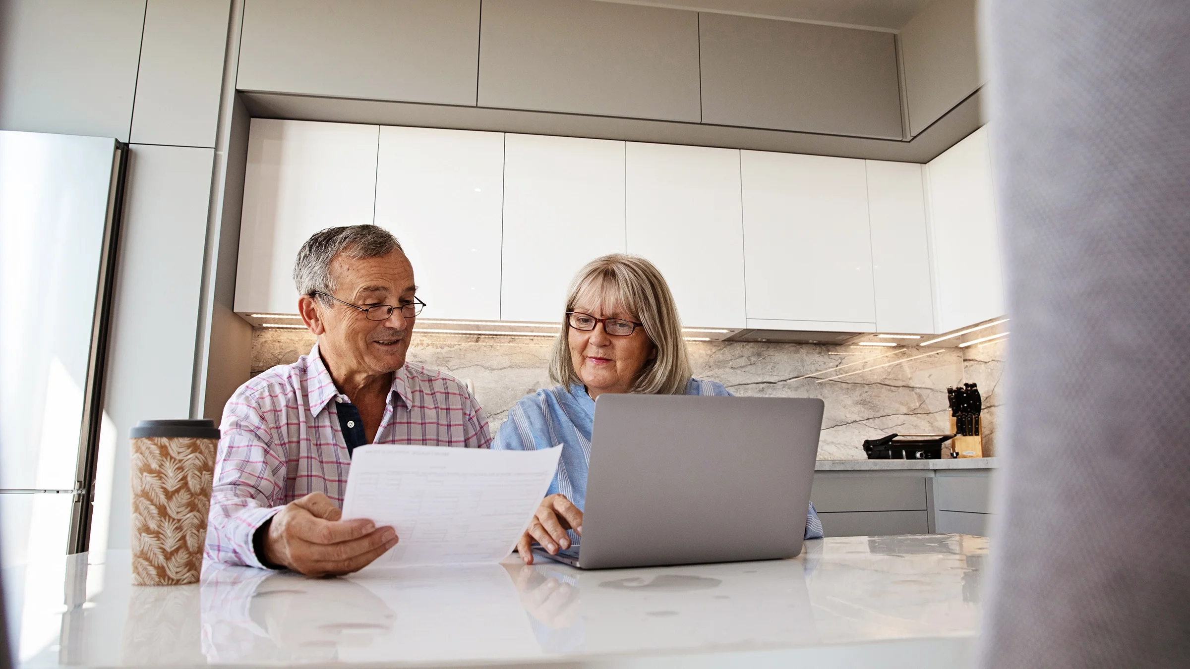 Couple doing finances at home.