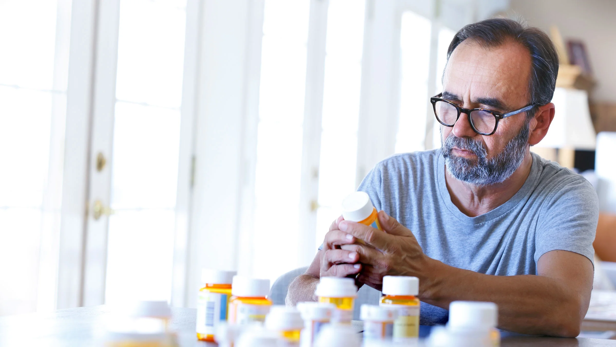 Man reading medication label