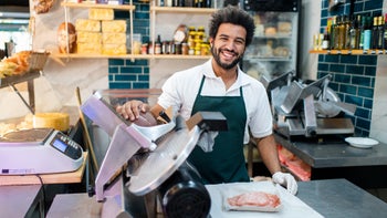 Diet Nutrition: butcher slicing deli meat 2159332709