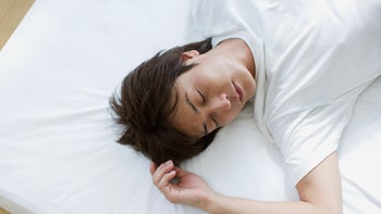Sleep: man sleeping on mattress without a pillow 71928297