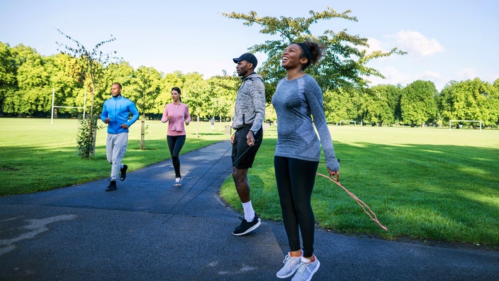Group of people working out in a park.