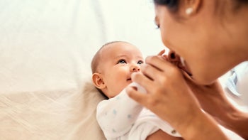 Parenthood: mother bonding with baby 921844460