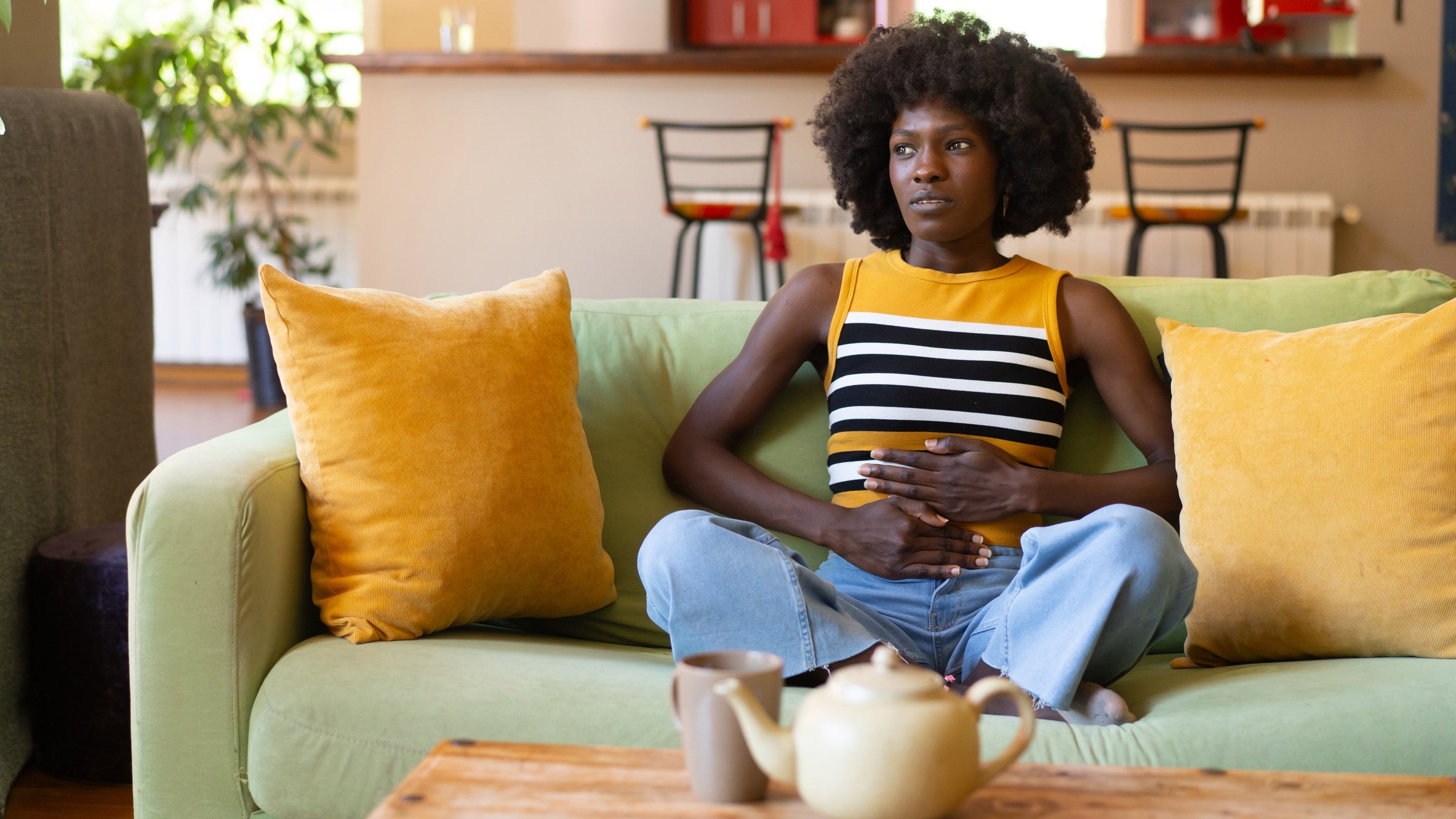 gut health: holding abdomen 2149792202