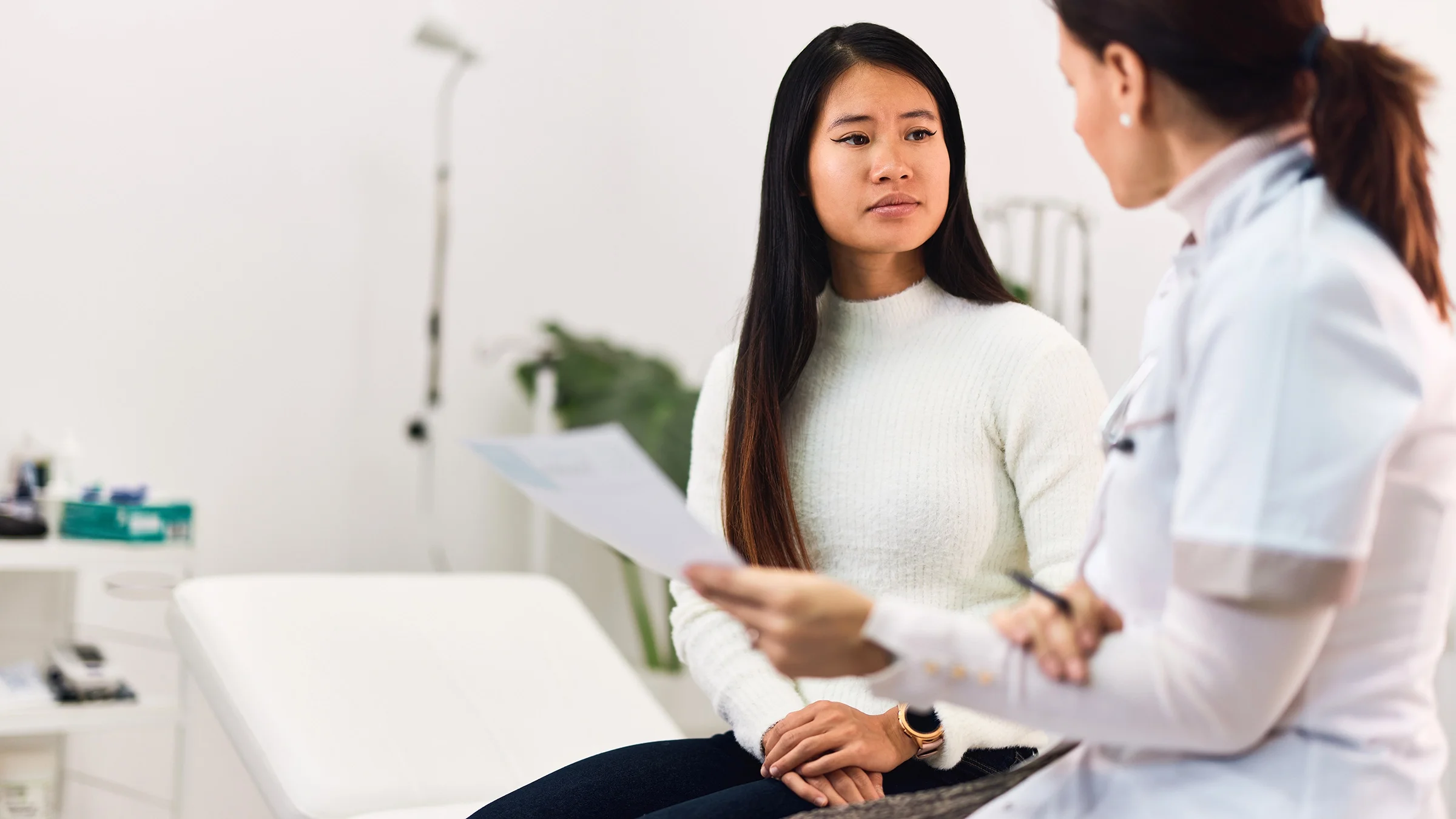 Woman at appointment with healthcare professional.