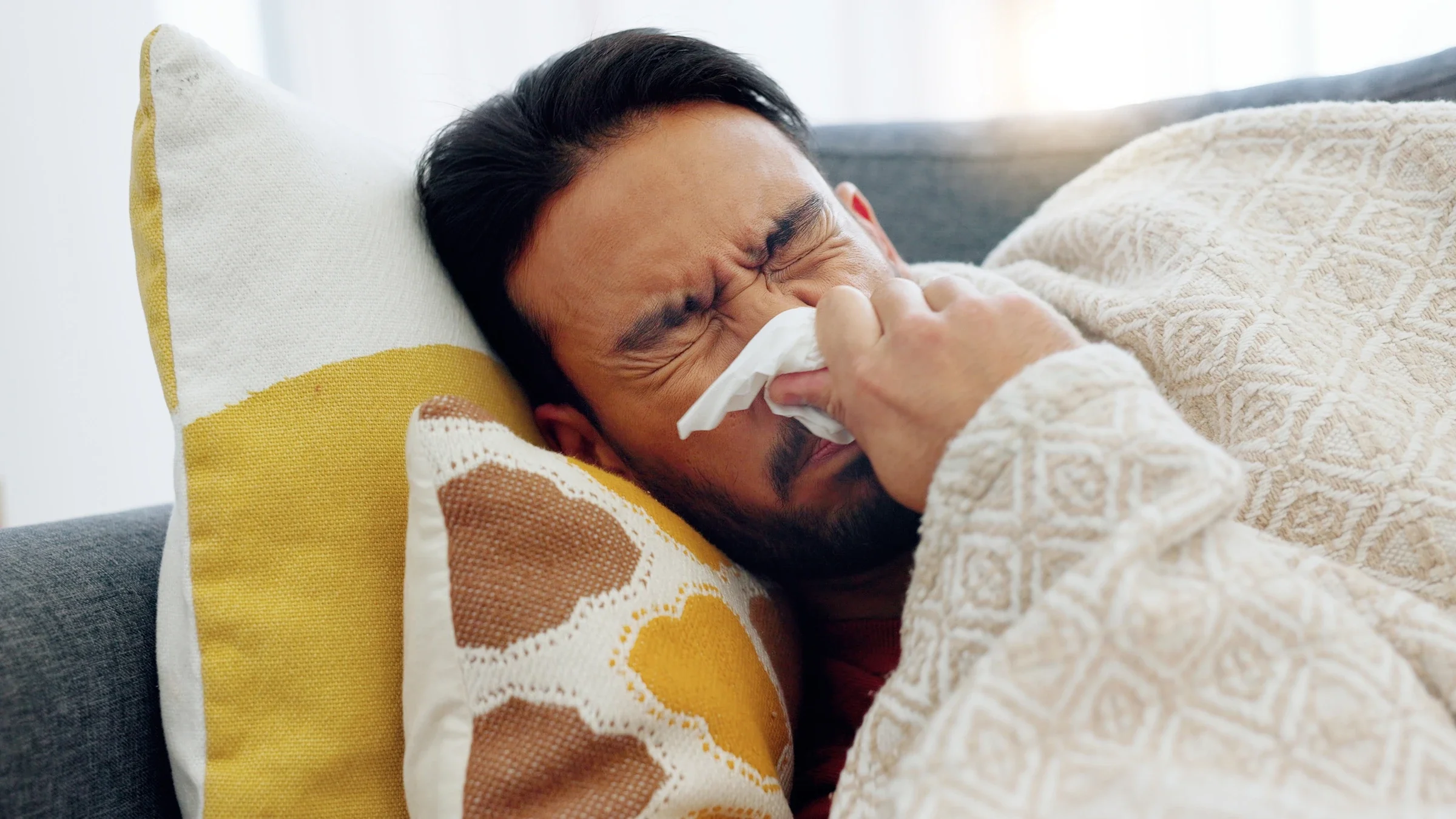 Man blowing his nose