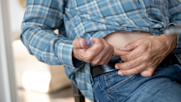 Close-up of an older man giving himself an insulin injection.
FatCamera/E+ via Getty Images