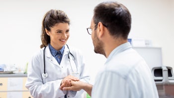 Substance use disorder: doctor holding patients hand 1402239900