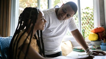 Children's health: father helping daughter with homework 1397416344