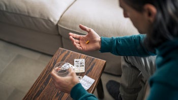 Trileptal: man with pill and water 1372814954