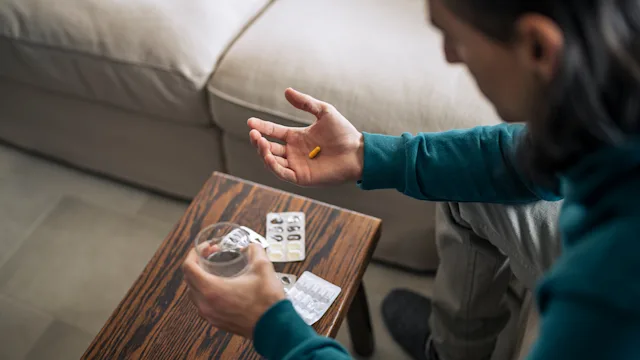 Trileptal: man with pill and water 1372814954