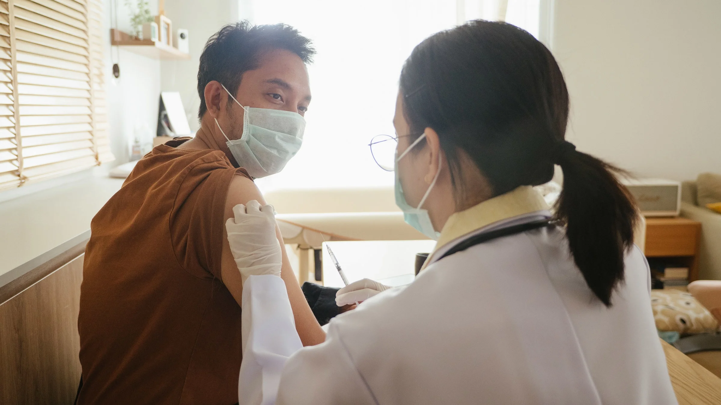 A HCP administering an at-home vaccine.