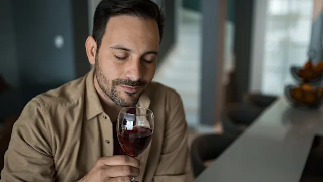 alcohol: man drinking red wine 1468676894