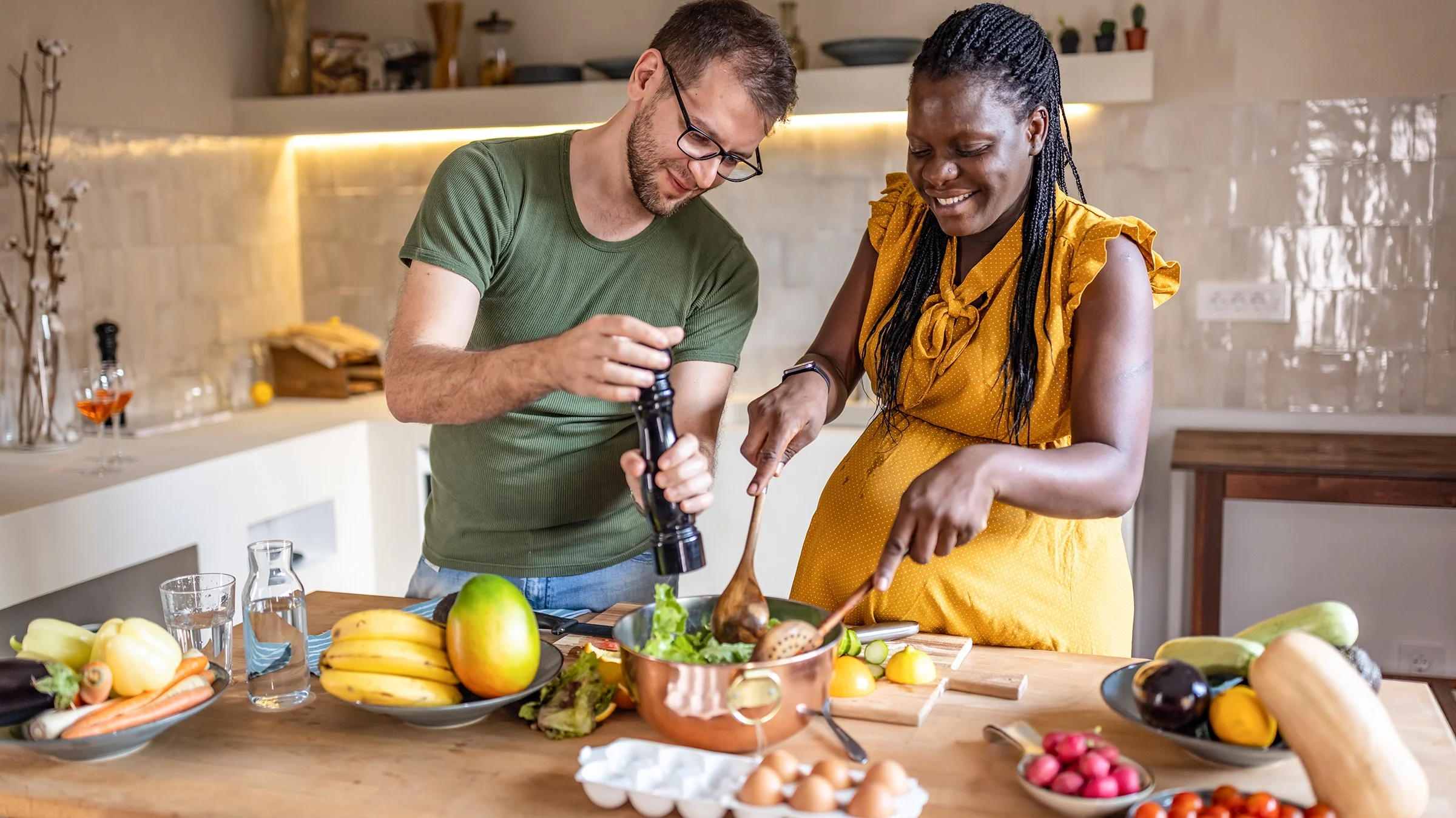 Couple cooking together at home.