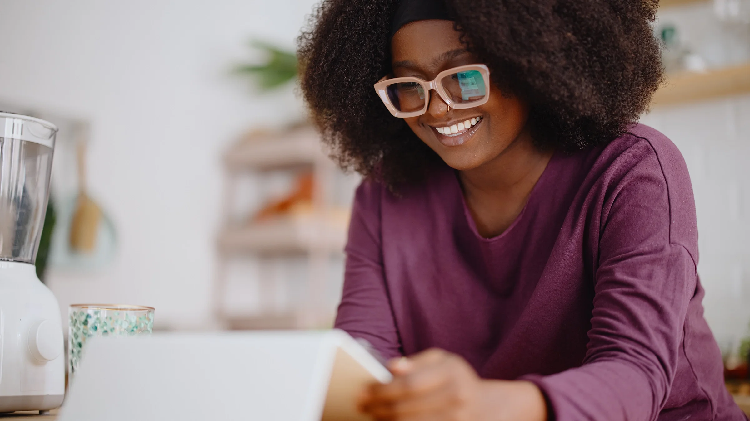 A woman uses a digital tablet to browse the internet.