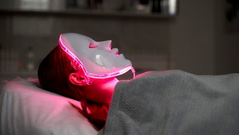 Sleep: woman wearing red light mask 1920066101