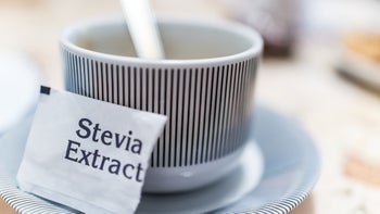 Diet-nutrition: closeup stevia packet with a mug 638304292