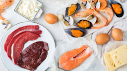 Flat lay image of various foods that are rich in vitamin B12.
Aamulya/iStock via Getty Images