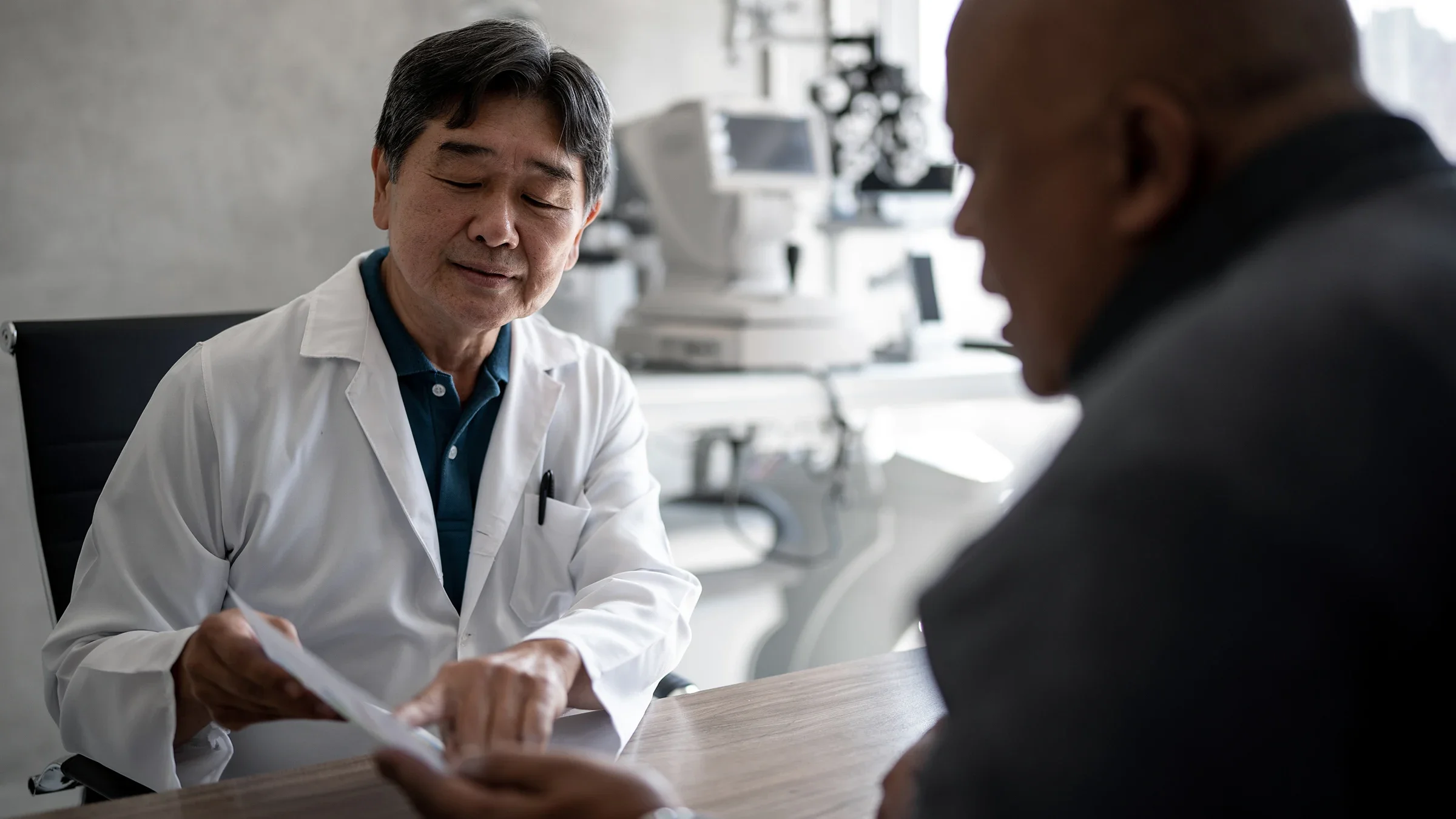 An ophthalmologist discusses a patient’s results during an eye exam.
FG Trade/E+ via Getty Images