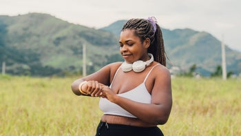 women's health: woman walking outdoors 2084882212