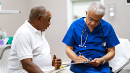A man discusses his health goals with his doctor.
FatCamera/E+ via Getty Images